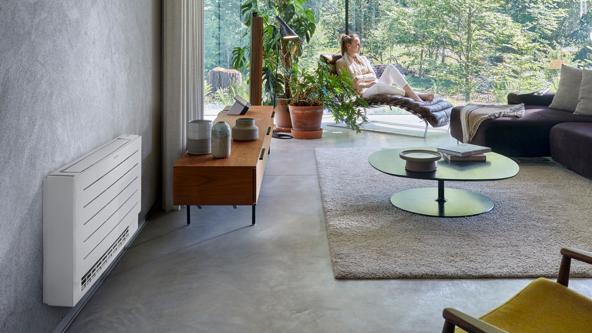 a woman looking out the window in her living room
