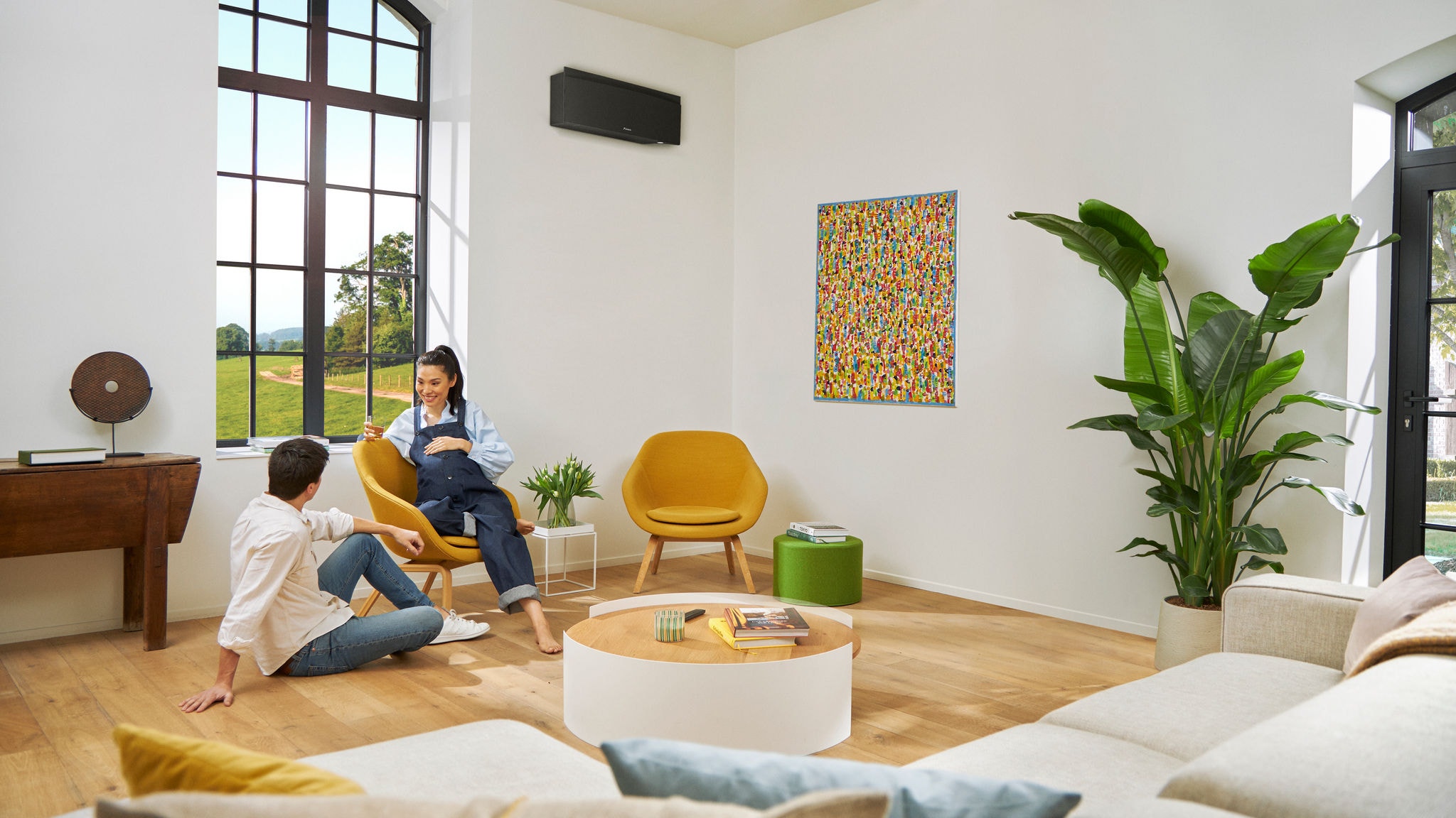 A couple sitting in their living room